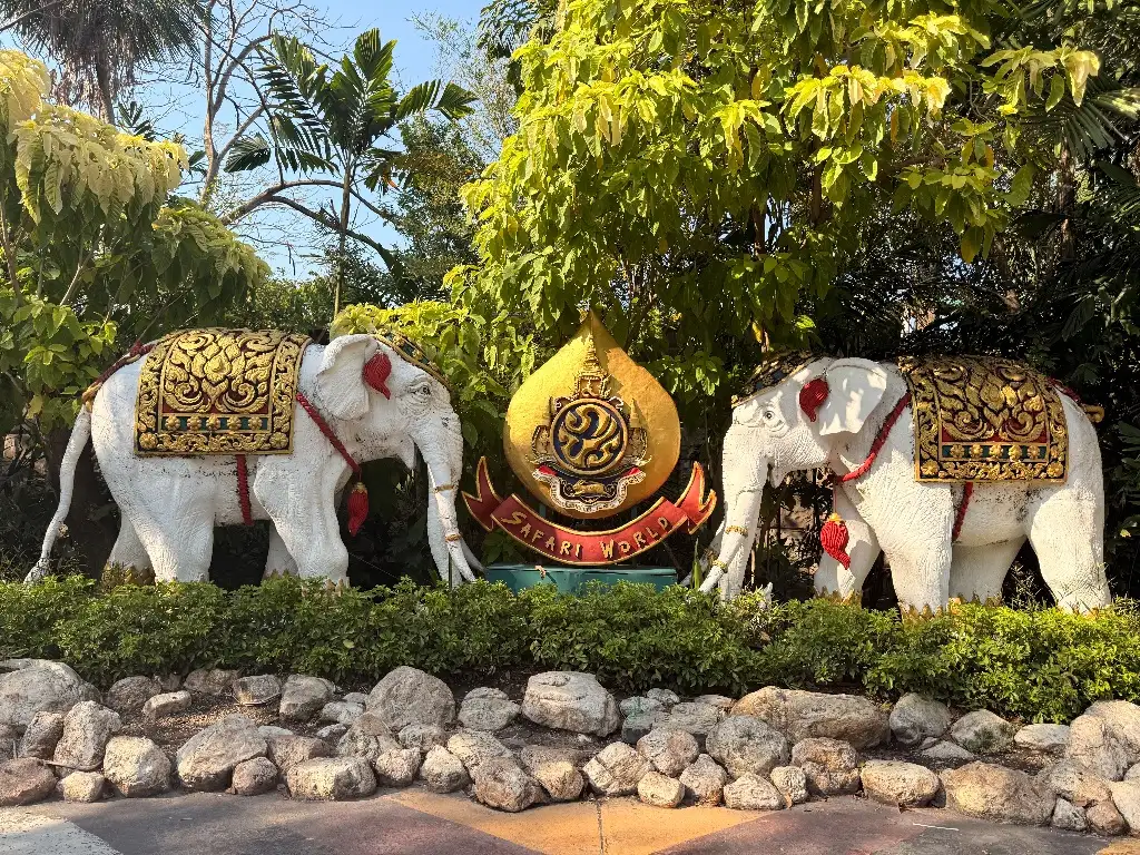 Decorative white elephant statues in the gardens of Safari World